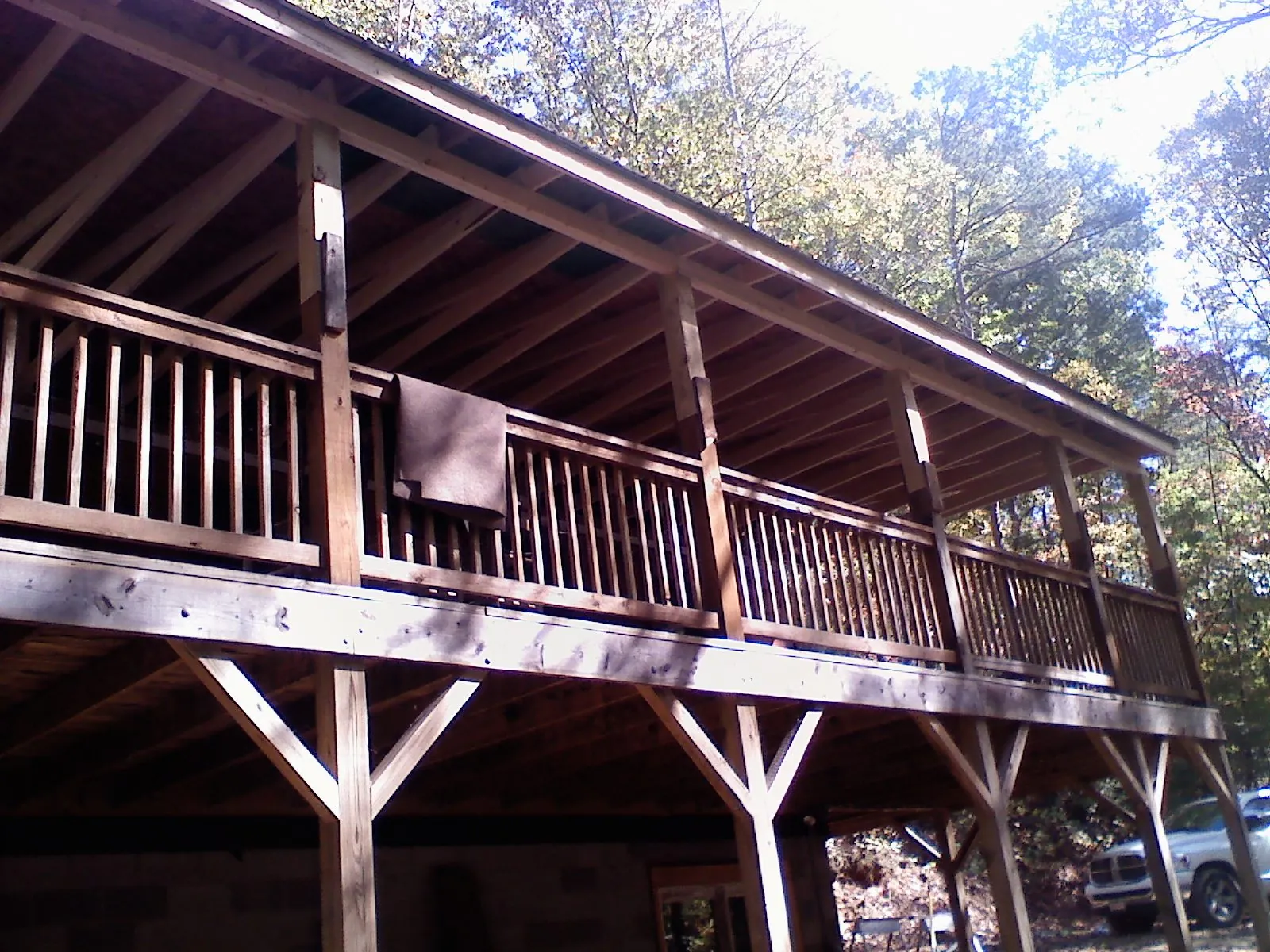 Timber framing under a new elevated porch and deck in Rockingham